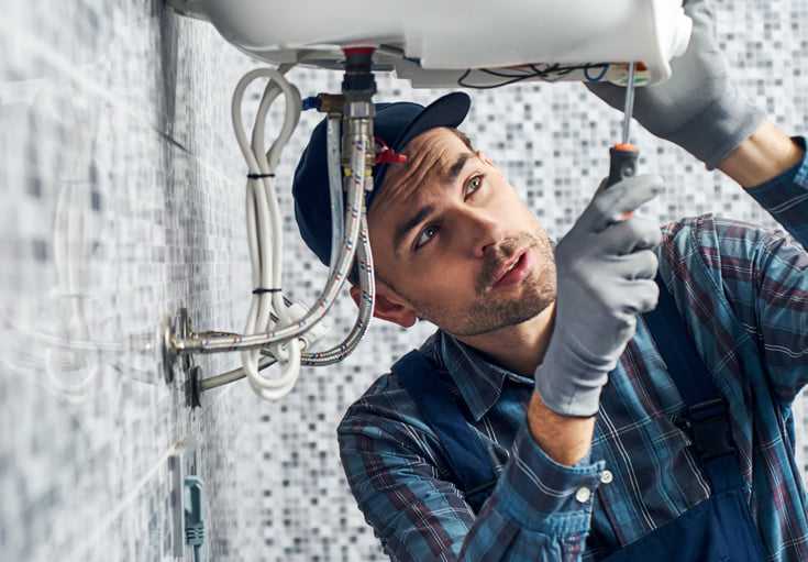 Plumber Working on Sink – Expert Service from Renew Plumbing